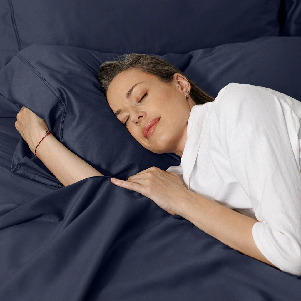 Woman sleeping soundly on Miracle cooling pillowcase